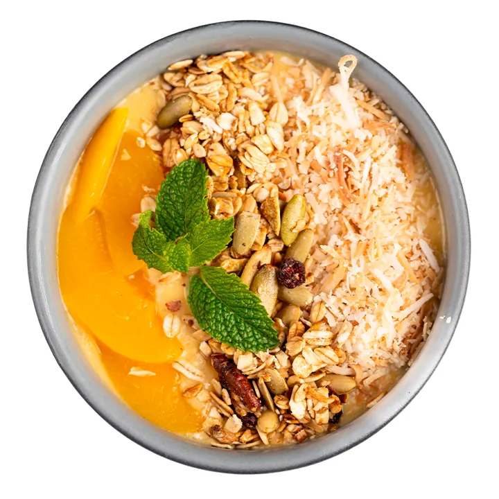 Ver foto de Smothie Bowl Tropical Batido de mango, piña y coco, con leche vegetal
y yogurt.